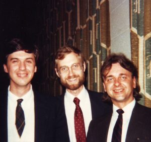 three-shot of men in ties