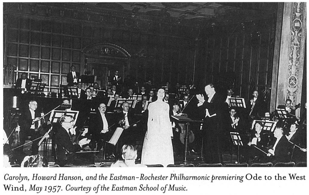 Woman in front of orchestra