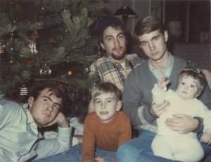 five kids by a Xmas tree