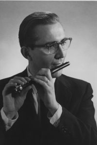 man playing piccolo