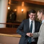 Barry Kempton and Thomas Kempton shakes Thomas's hand for An die Musik Award